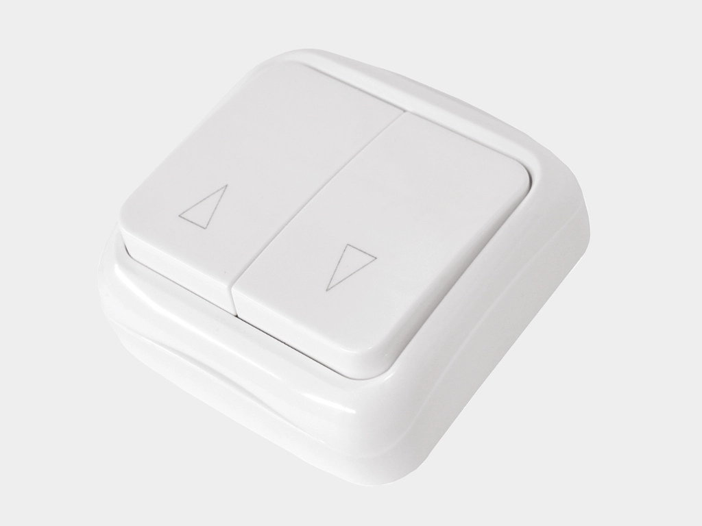 Клaвишный двухпозиционный выключатель накладной для управления приводом в обе стороны движения.